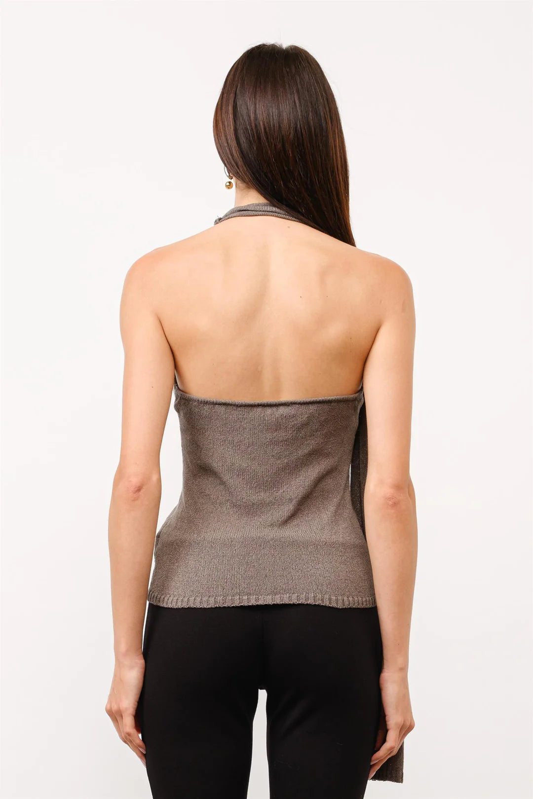 Back view of women's taupe halter knit top highlighting the sleeveless silhouette and fine-knit fabric.
