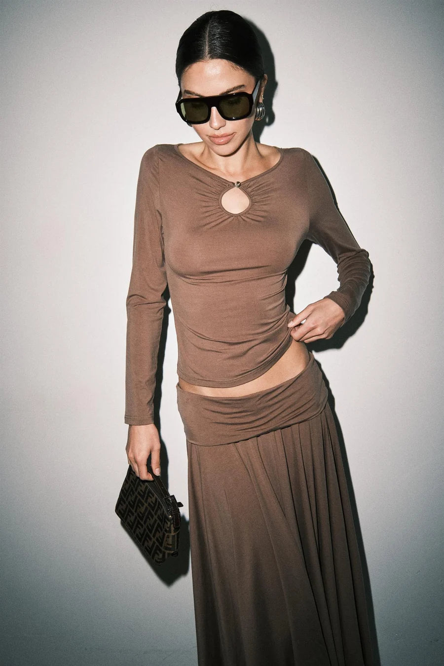 Women's brown ruched long sleeve top with keyhole cutout neckline