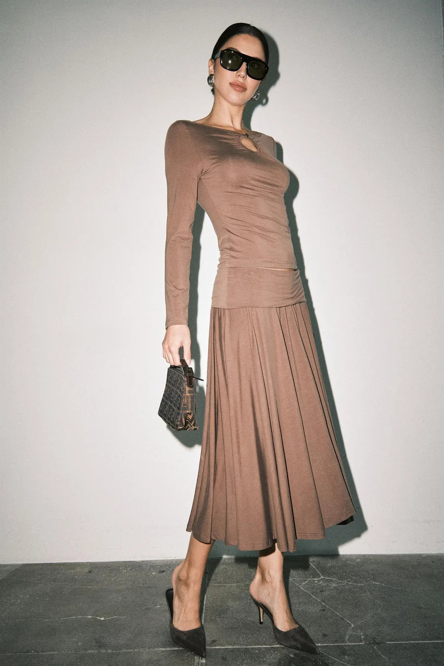 Women's brown ruched long sleeve top with keyhole cutout neckline