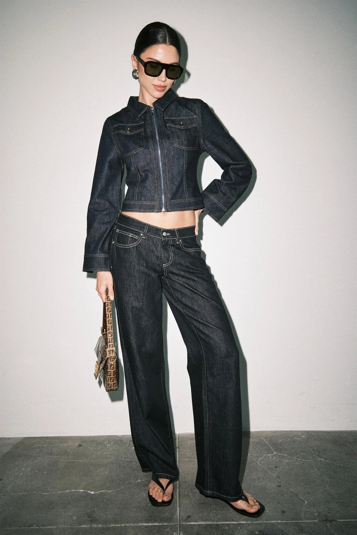 Women's dark wash wide leg jeans front view with contrast stitching