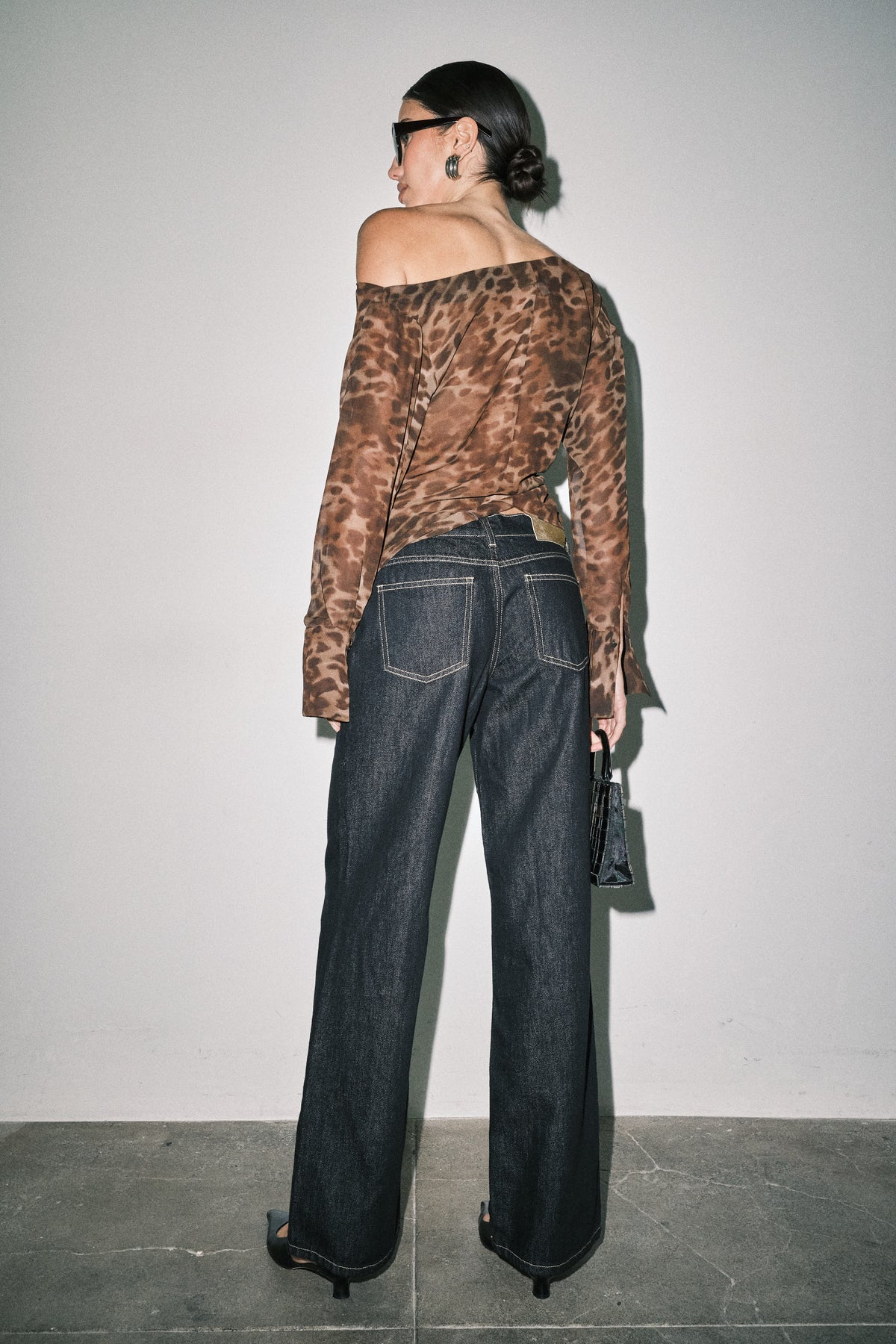 Back view of women's wide leg denim jeans showing classic back pocket design