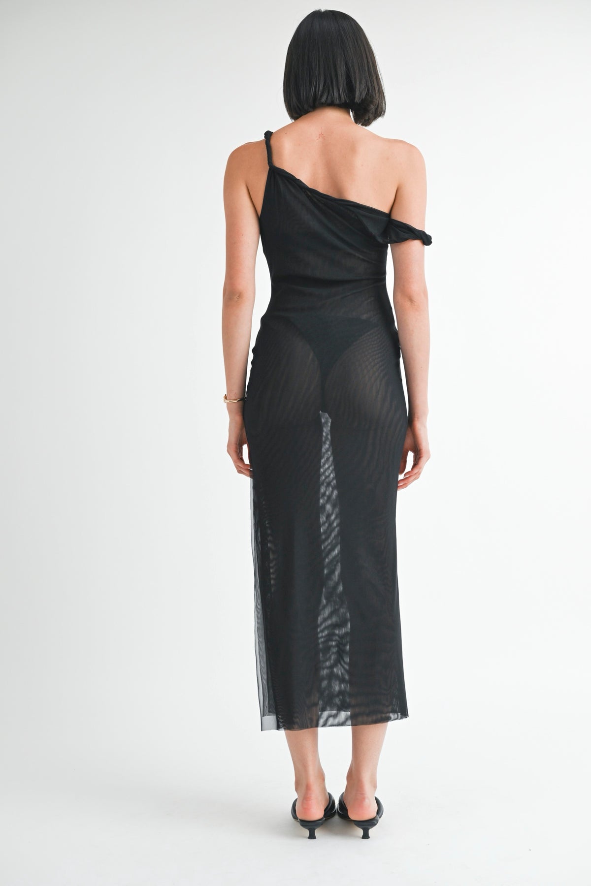 Back view of women's black mesh midi dress featuring a body-skimming silhouette and midi-length hemline.