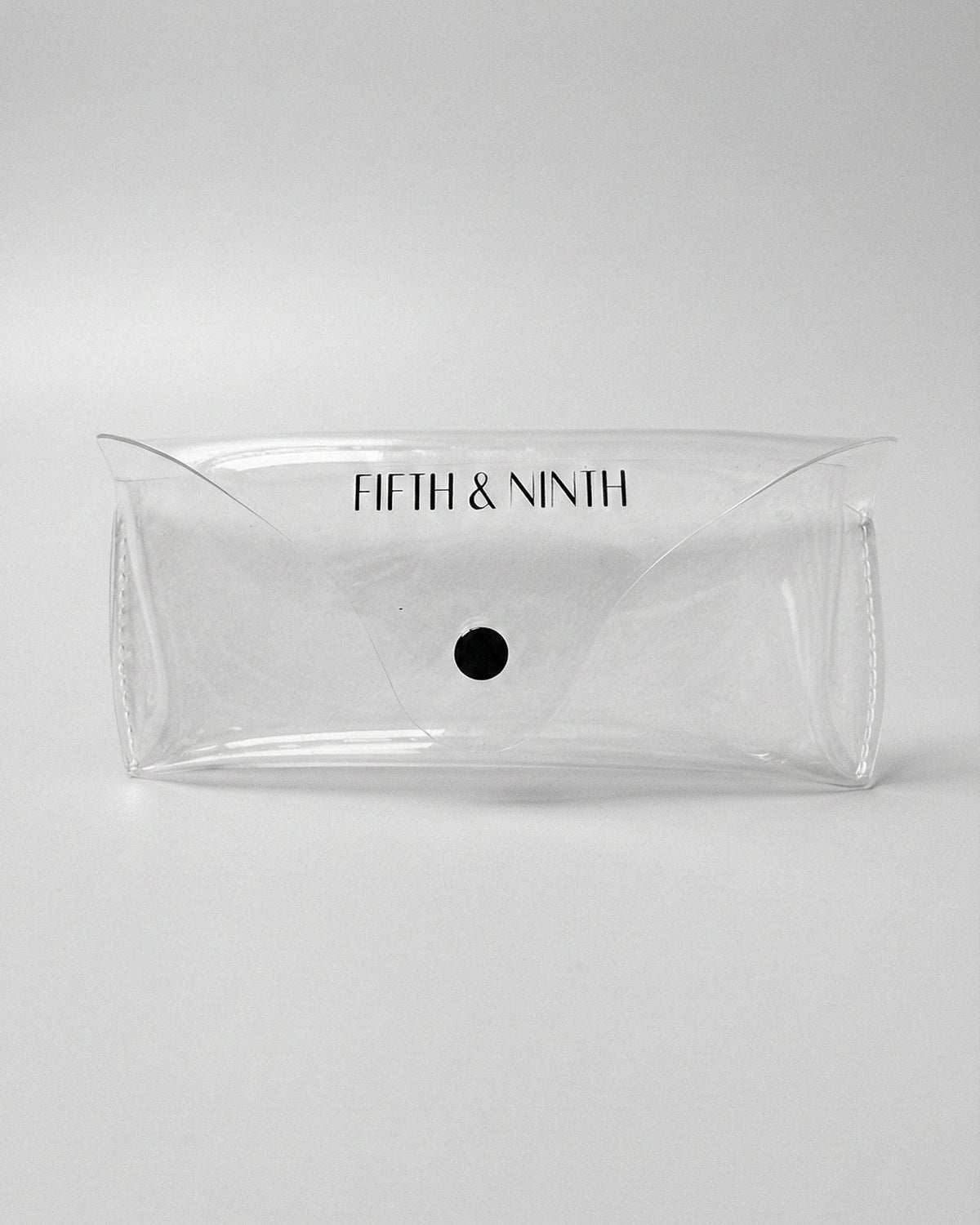Fifth & Ninth transparent protective travel case included with tortoiseshell oval polarized sunglasses.